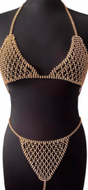Lingerie femme CRISTAL en strass doré au style bijou lumineux, design raffiné et éclat précieux qui sublime la silhouette avec une touche couture élégante